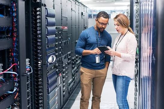 Data center engineer working on rack integration for AI SuperCluster deployment